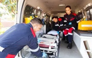 Paramedics preparing to help a patient in cardiac arrest, San Diego.