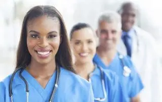 group of happy healthcare workers line up